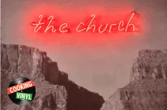 Text: „the church“
Darstellung: Neonlicht-Schriftzug über einer canyonartigen Landschaft. Links unten: Rundes Logo „Cooking Vinyl“.