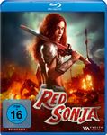 „Red Sonja“, FSK 16, eine rothaarige Kriegerin mit Schwert vor brennender Stadt im Hintergrund.