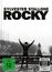 Text: "SYLVESTER STALLONE ROCKY", "FSK ab 12 freigegeben", "4K Ultra HD". Szene: Person hebt triumphierend die Arme auf einer Treppe.
