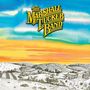 "The Marshall Tucker Band" in gelber Schrift, darüber Illustration einer Landschaft mit Bäumen und Feldern; blauer Himmel.