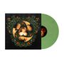 Schwarzes Cover mit Blumenmuster und drei Gesichtern in einem kreisförmigen Design. Grüne Vinylplatte rechts., LP