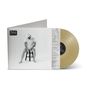 "Mule Orville Peck" zeigt einen Mann in weißem Outfit und Cowboyhut auf einem Hocker sitzend, mit hellem Vinyl daneben., LP