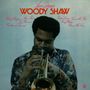 Texte: "Love Dance," "Woody Shaw," Musiker spielt Trompete, trägt ein bunt gemustertes Hemd., CD