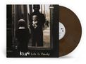 "Life Is Peachy" ist der Text, mit einem Kind, das in einem Spiegel steht. Eine braune Vinyl-Schallplatte ist sichtbar., LP