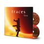 Der Text "traces live" steht im Vordergrund. Eine Silhouette einer Person mit Mikrofon springt vor einem leuchtend orangen Hintergrund., 2 CDs
