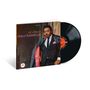 "el chico", "chico hamilton". Ein Vinyl-Album mit Cover eines Mannes im Anzug. Rechts die schwarze Schallplatte., LP