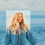 Text: "ashley cooke". Eine lächelnde Frau mit langen blonden Haaren in einer Jeansjacke vor einem verschwommenen Strandhintergrund., CD