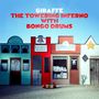 Texte: "GIRAFFE THE TOWERING INFERNO WITH BONGO DRUMS", "Hotel", "Coyote Meadow Schoolhouse", "General Store", "Sheriff". Bunte Fassaden., LP
