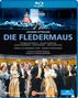 Blu-ray-Cover für "Die Fledermaus" von Johann Strauss am Theater an der Wien, bunt gekleidete Darsteller.