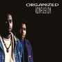 Text: "ORGANIZED KONFUSION". Zwei Männer blicken ernst, der Vordergrund trägt ein Amulett und Jeansjacke., CD