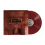 In der Mitte steht "LOUDER NOW $1.52". Rote Schallplatte, Person hinter Glasscheibe mit metallischem Gitter vor dem Gesicht., LP
