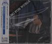 "PIANO FOR NURIA" oben, japanischer Text links, Mann in Anzug mit Sonnenbrille am Klavier., CD