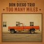 "Don Diego Trio", "Too Many Miles", oranger, alter Pickup vor weißer Wand, rostig, zwei Fenster im Hintergrund., LP