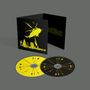 Das Bild zeigt zwei CDs und eine Hülle. Die Hülle hat gelben Text und eine Illustration eines Helikopters., 2 CDs