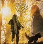 Text: „Running round the Sun“. Silhouetten von Mann und Hund in sonnigem Waldhintergrund., LP