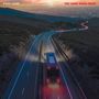 Text: "Paul Laine" und "The Long Road Back". Landschaft mit Straße, ein Bus fährt bei Sonnenuntergang. Lichter leuchten., CD