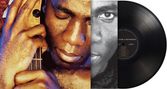 "Richard Bona Reverence" steht auf einer Schallplatte. Links ein verschwitzter Mann mit geschlossenen Augen, der ein Instrument hält., LP
