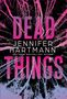 "DEAD THINGS" in großen Buchstaben, darunter "Jennifer Hartmann", Hintergrund: rosa und blaue Zweige auf schwarzem Grund., Buch