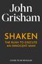 Weiße und orangefarbene Schrift auf schwarzem Hintergrund: "John Grisham", "SHAKEN", "THE RUSH TO EXECUTE AN INNOCENT MAN"., Buch