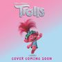 Text: "Trolls", "Cover Coming Soon". Illustration: Ein fröhlicher Troll mit pinkem Haar und Blumenkranz auf pink-blauem Hintergrund., Buch