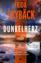 Text: "FRIDA SKYBÄCK, DUNKELHERZ, EIN FALL FÜR FREDRIKA STORM, DER BESTSELLER AUS SCHWEDEN." Hintergrund: See mit Haus., Buch