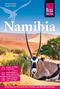 "Namibia" in großen Buchstaben, darunter eine liegende Antilope vor einer Wüstenlandschaft mit Bäumen und Dünen., Buch