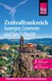 Text: "Zentralfrankreich - Auvergne, Cevennen und Tarn-Schlucht. Bettina Forst. Reiseführer für individuelles Entdecken."  
Darunter ein altes Gebäude auf einem Felsen., Buch