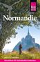 „Normandie“, „Barbara und Hans Otzen“, „Reiseführer für individuelles Entdecken“. Ein Radfahrer auf einem Pfad vor einer Abtei., Buch