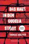 „Das Haus in dem Gudelia stirbt“ von Thomas Knüwer. Hintergrund: Rote Ziegelwand mit schwarzen Fugen., Buch