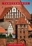 "Tangermünde: Der Stadtführer. Verlag Janos Stekovics." Sicht auf historische Backsteinarchitektur mit Fachwerkhaus., Buch