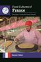 "Food Cultures of France", "Recipes, Customs, and Issues". Eine Frau backt Crêpes, trägt rot gestrickte Mütze., Buch