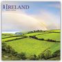 2027 Ireland, 16-Month Calendar. Ein Regenbogen wölbt sich über grüne Felder mit einem Küstenausblick., Kalender