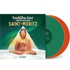 „buddha-bar Winter Sessions Saint-Moritz, By Ravin.“ Ein Buddha auf schneebedecktem Boden, bunte Vinylplatten.
