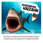 Logo mit Text "AUSGRABUNG HAIZAHN". Haialarm! Tauche ein in ein Meeresszenario mit offenem Haimaul.
