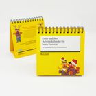 "Ernie und Bert Adventskalender für beste Freunde". Gelbes Cover, zeigt Ernie und Bert mit Weihnachtsmützen. Spiralbindung.
