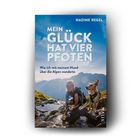 Titel: "MEIN GLÜCK HAT VIER PFOTEN". Untertitel: "Wie ich mit meinem Hund über die Alpen wanderte". Frau und Hund in Berglandschaft.