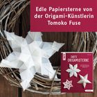 Edle Papiersterne von der Origami-Künstlerin Tomoko Fuse. Drei filigrane weiße Origami-Sterne auf Holz und Zweigen.