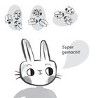Text: „Lösung: Diese Käfer haben zusammen sieben Punkte. Super gemacht!“ Illustration: Ein Kaninchen lobt vor Käfern.