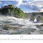 Rheinfall, Schaffhausen. Kalenderseite Oktober. Tosender Wasserfall mit Burg auf bewaldetem Hügel im Hintergrund.