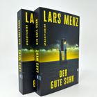 "LARS MENZ, DER GUTE SOHN, Kriminalroman." Zwei Bücher mit düsterem Cover: Turm vor stürmischem Himmel und Meer.
