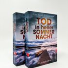 Zwei Bücher mit dem Titel "Tod in heller Sommernacht" von Lisa Sarah Brandstätter, darunter ein Steg am See.