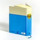 "Bibel in gerechter Sprache" auf gelbem Kreis, darunter "Gütersloher Verlagshaus". Blauer Buchrücken, creme und blaues Cover.