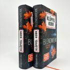 Zwei Bücher mit dem Titel "BLENDWERK" von KLÜPFEL KOBR, dekoriert mit orangefarbenen Blättern.