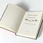„GEORGE ORWELL – Farm der Tiere – Aus dem Englischen von Heike Holtsch - Anaconda“. Geöffneter Buchumschlag.