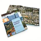"Glücklich wohnen - Wiener Alltag im Wohnpark Alt-Erlaa" steht in einem Buchcover, dahinter ist ein Hochhaus mit vielen Balkonen.