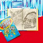 "SCUBA CATS" in großen Buchstaben auf einem blauen Buchcover mit Katzen in Taucheranzügen und einer Illustration im Hintergrund.