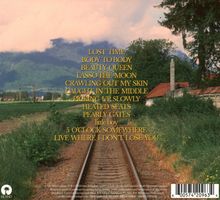 Texte: LOST TIME, BODY TO BODY, BEAUTY QUEEN, LASSO THE MOON, 5 O'CLOCK SOMEWHERE. Landschaft mit Bahngleisen.