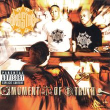 Text: "Moment of Truth", "Parental Advisory Explicit Content", "Gang Starr." Zwei Personen stehen vor einem Richter. Logo sichtbar.