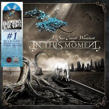 "A Star-Crossed Wasteland", "In This Moment", "#1 Billboard Independent Album". Illustration mit Baum und Pferd in Ödland.