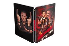Vorne: "VAN DAMME", "TONY SCHIENA", "WAKE OF DEATH" in Rot. Illustration von bewaffneten Personen in actionreichem Stil.